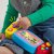 FISHER PRICE KONSOLA ABC MAŁEGO GRACZA UCZ SIĘ I ŚMIEJ HNN39